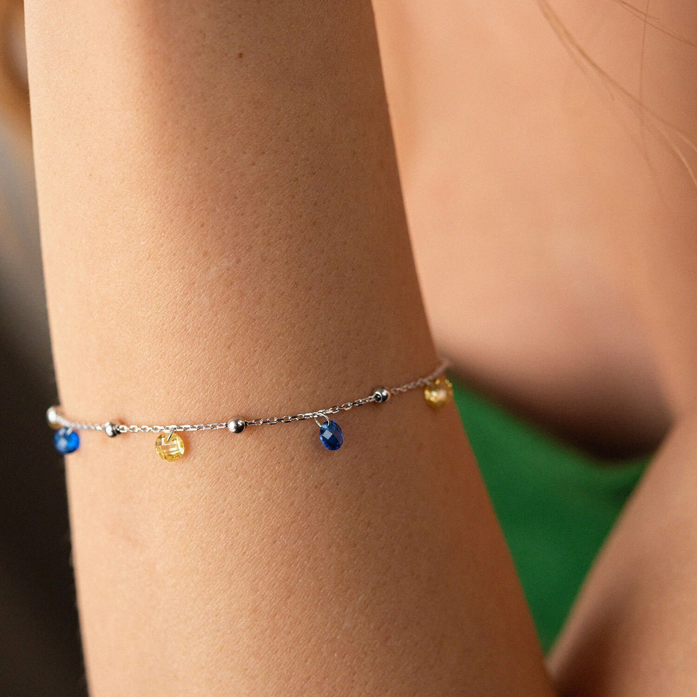 Gold Bracelet "Independent" with balls (blue and yellow cubic zirconia)