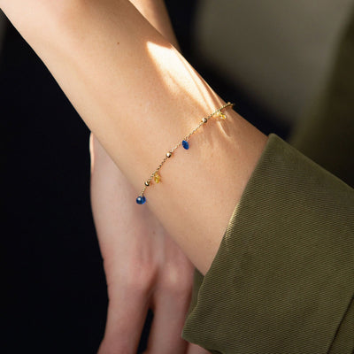 Gold Bracelet "Independent" with balls (blue and yellow cubic zirconia)