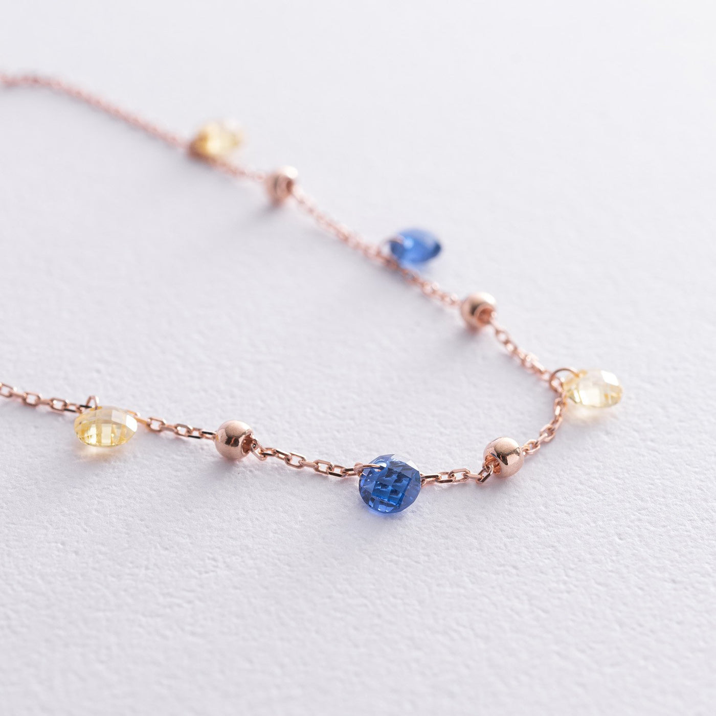 Gold Bracelet "Independent" with balls (blue and yellow cubic zirconia)