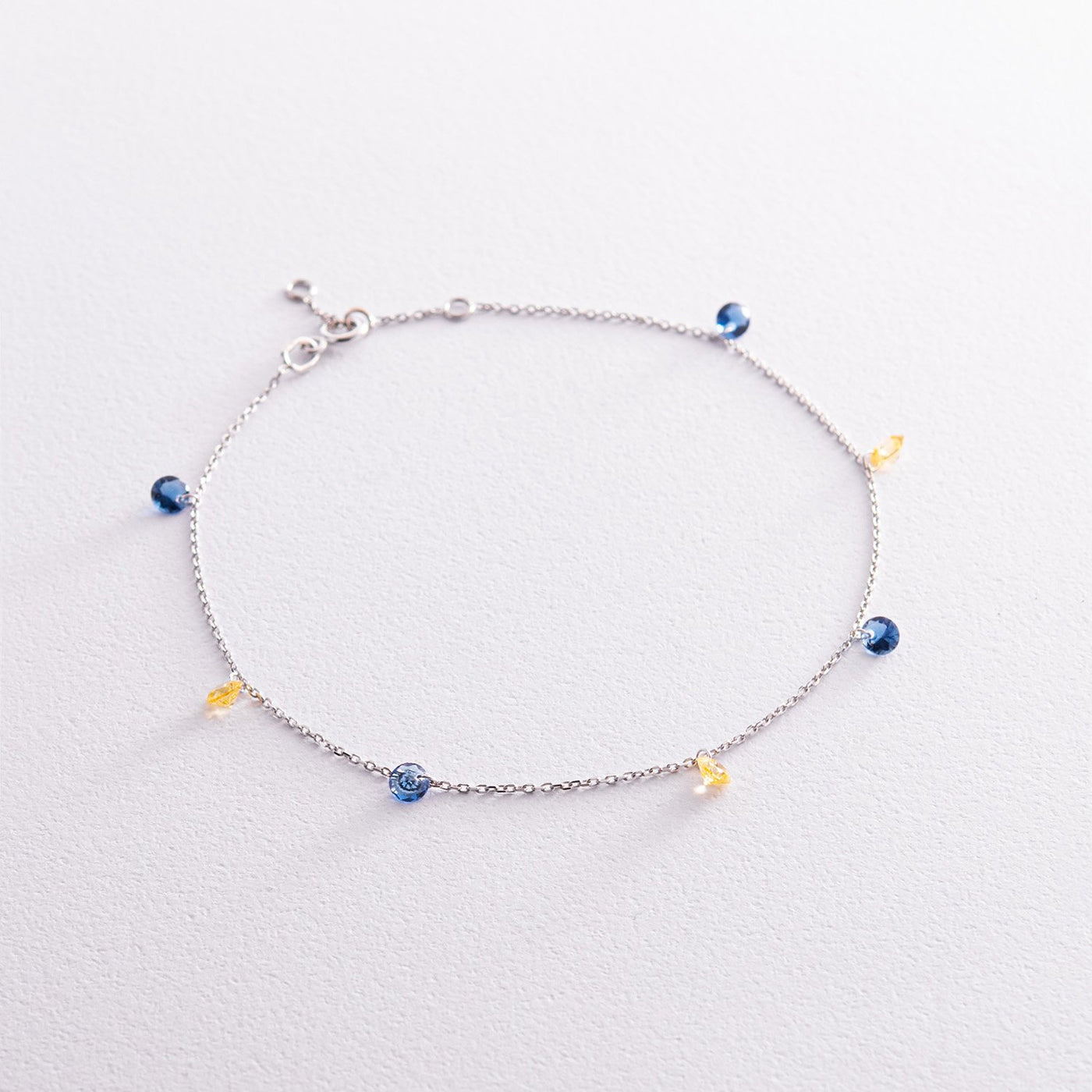 Gold anklet "Ukraine" (blue and yellow cubic zirconia)