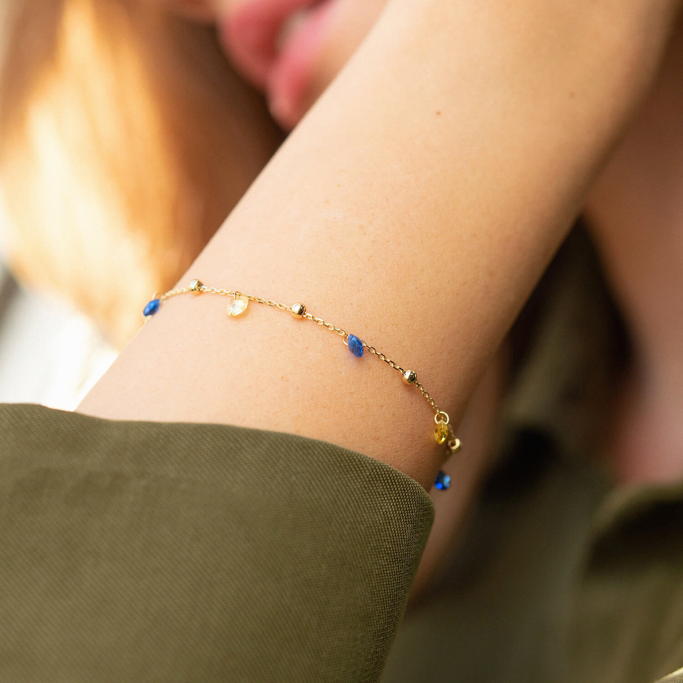 Gold Bracelet "Independent" with balls (blue and yellow cubic zirconia)