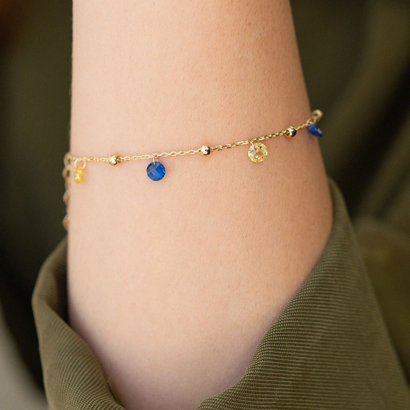 Gold Bracelet "Independent" with balls (blue and yellow cubic zirconia)