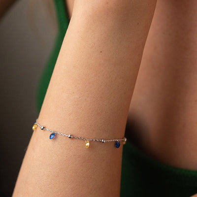 Gold Bracelet "Independent" with balls (blue and yellow cubic zirconia)