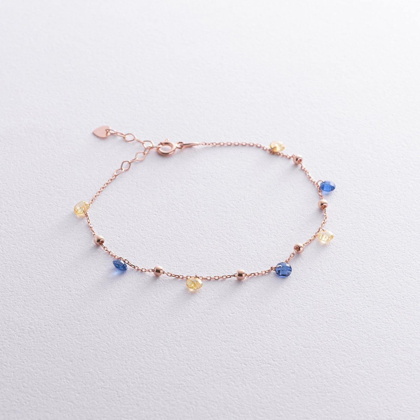 Gold Bracelet "Independent" with balls (blue and yellow cubic zirconia)