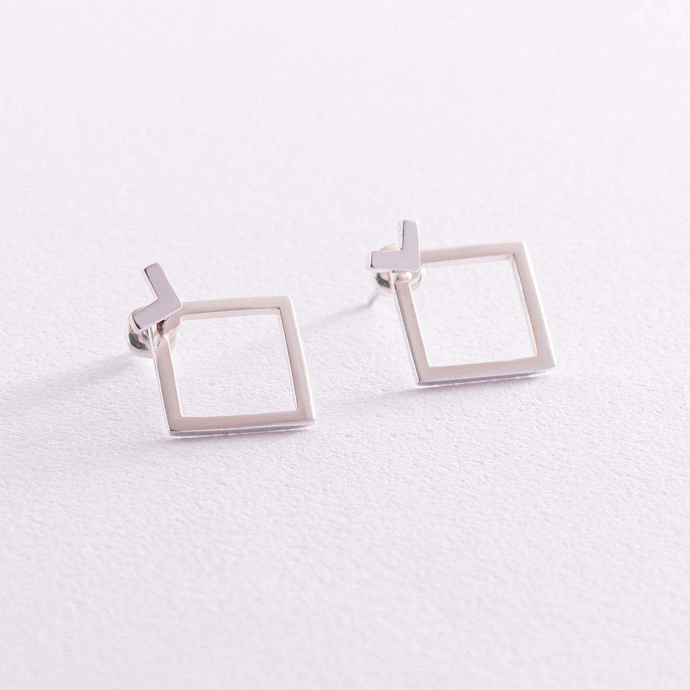 Silver diamond shape ear jacket earrings