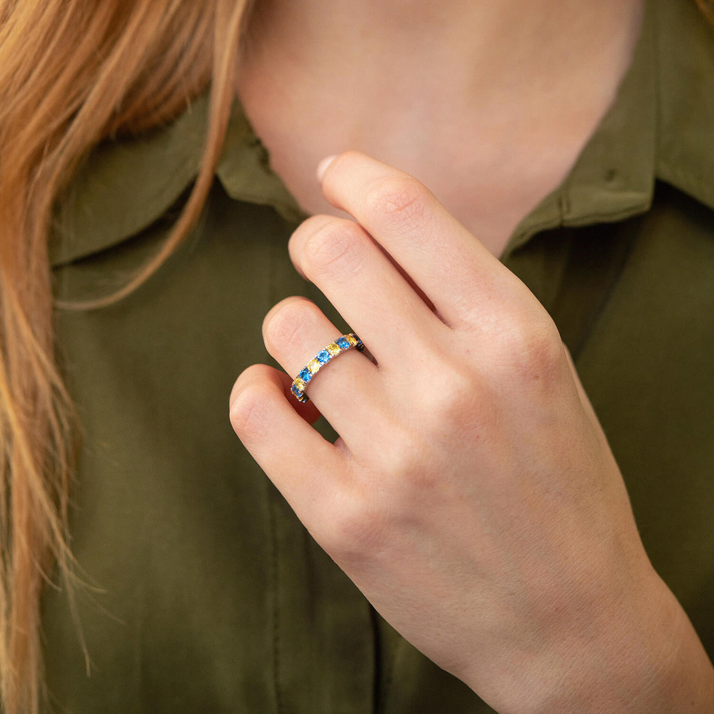 Ring with a path of blue and yellow cubic zirconia