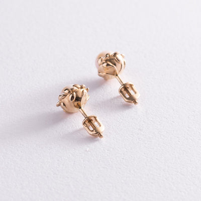 Gold stud earrings with pearls