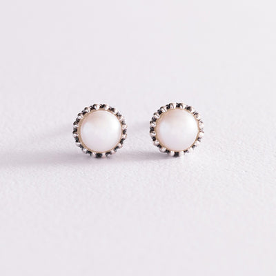 Silver stud earrings with pearls