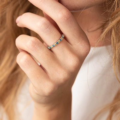 Ring with a path of blue and yellow cubic zirconia