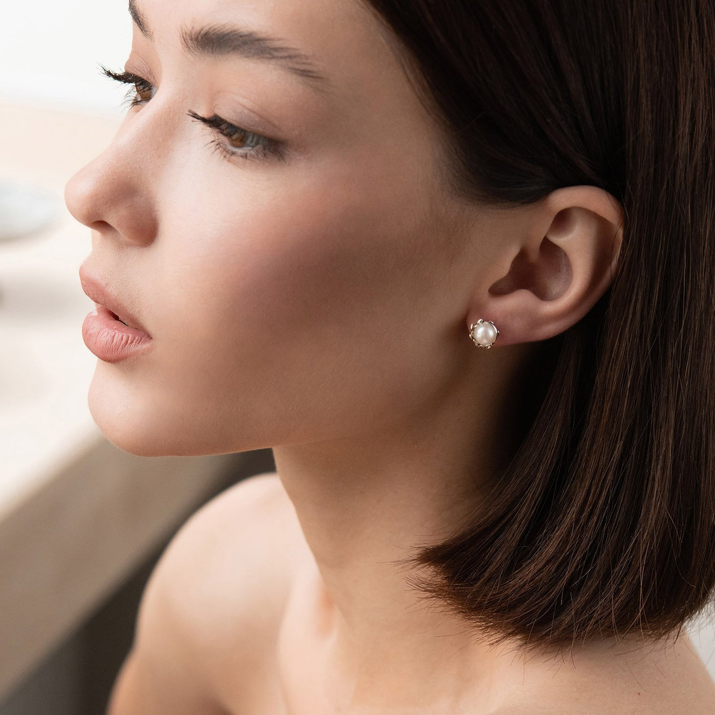 Silver stud earrings with pearls