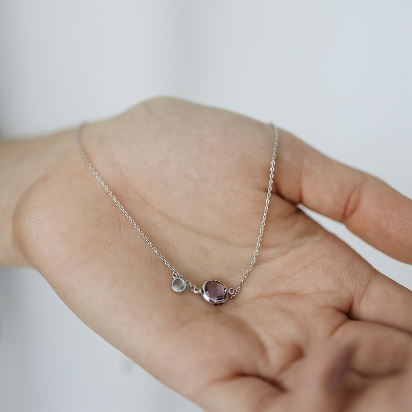 Gold necklace with amethyst and topaz