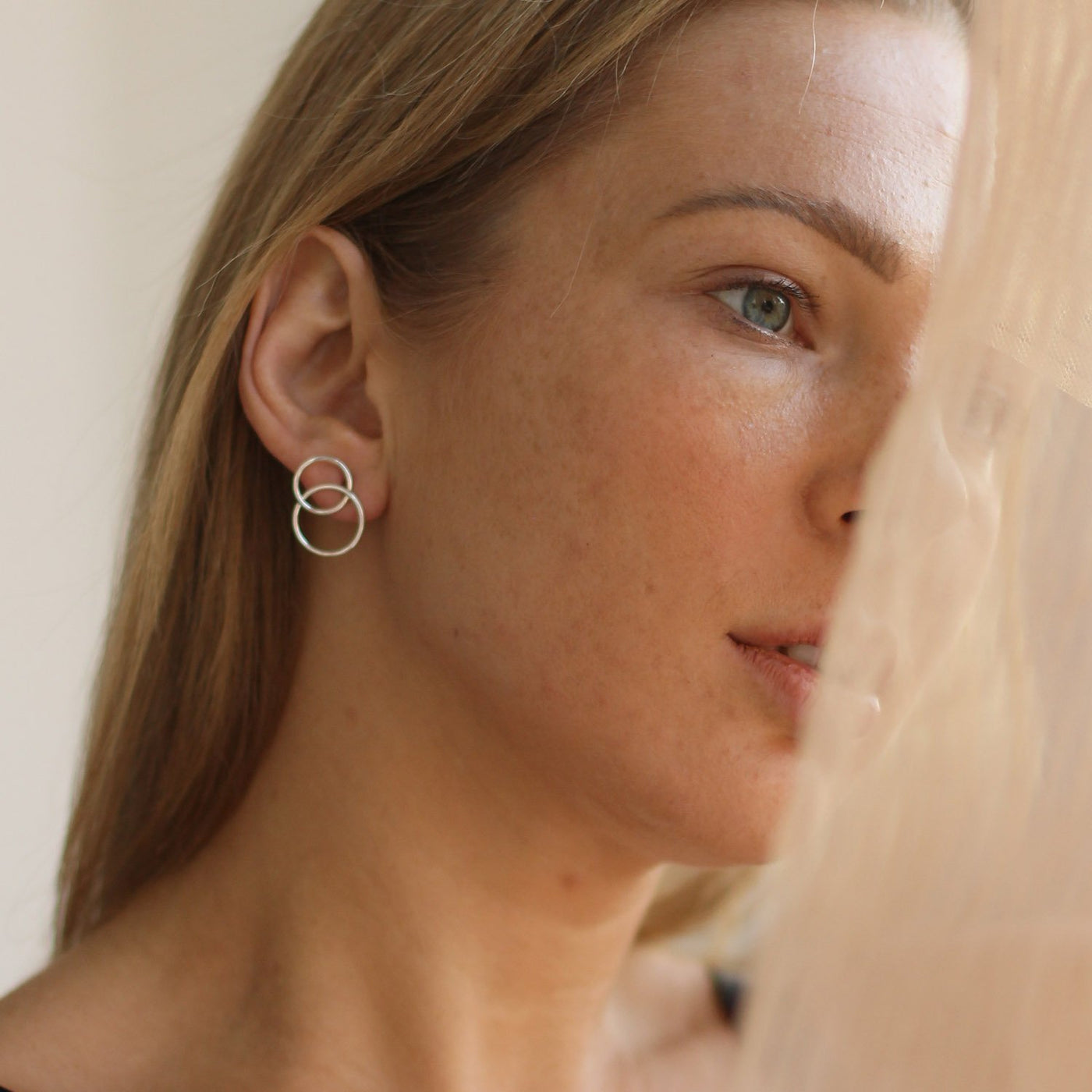 Silver stud earrings Interlacing of rings