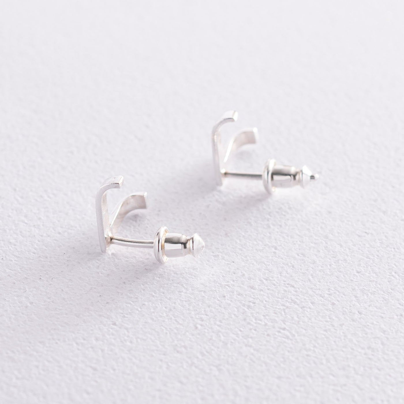 Silver stud earrings Accent