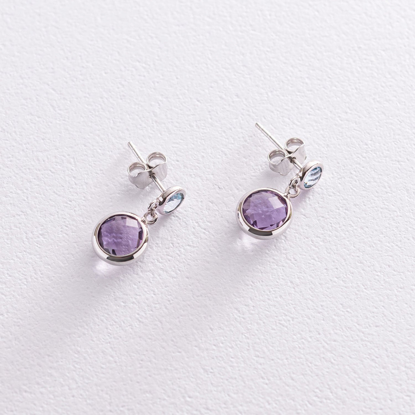 Gold stud earrings with amethyst and topaz