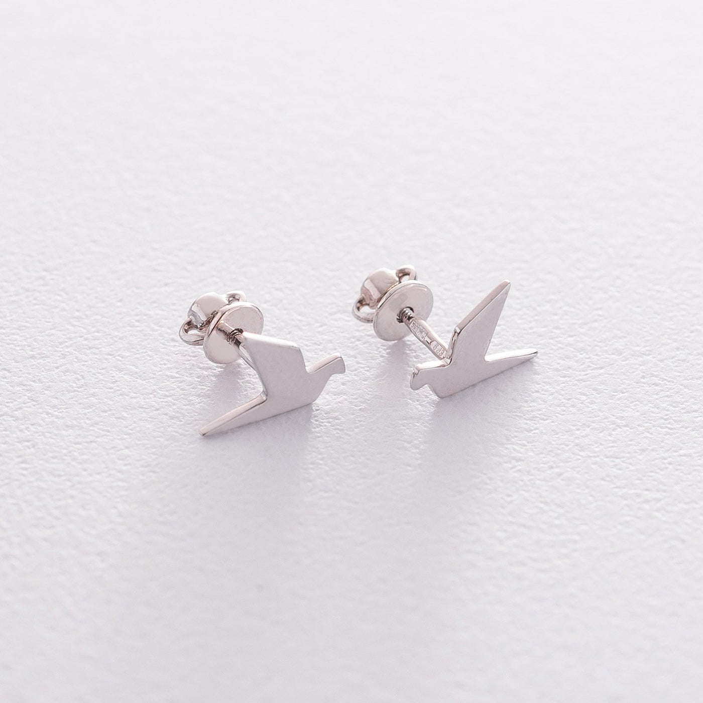 Gold stud flying birds earrings