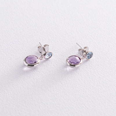 Gold stud earrings with amethyst and topaz