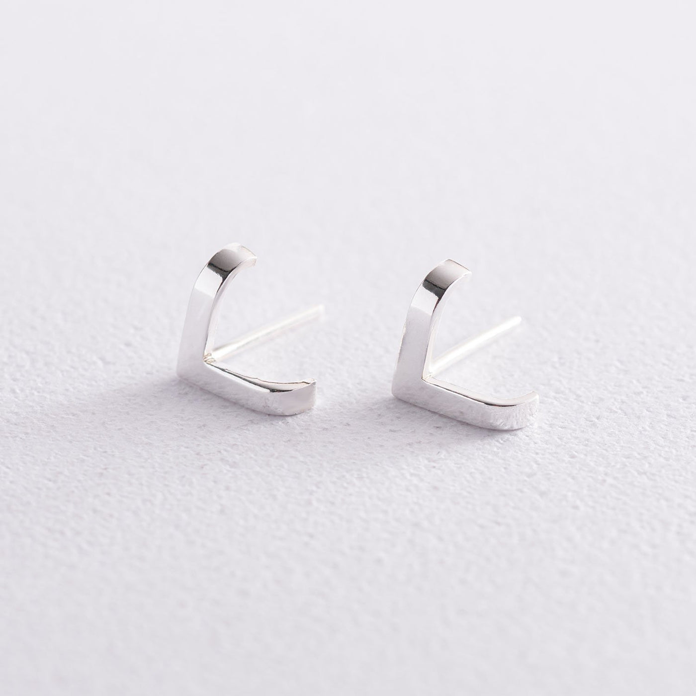 Silver stud earrings Accent