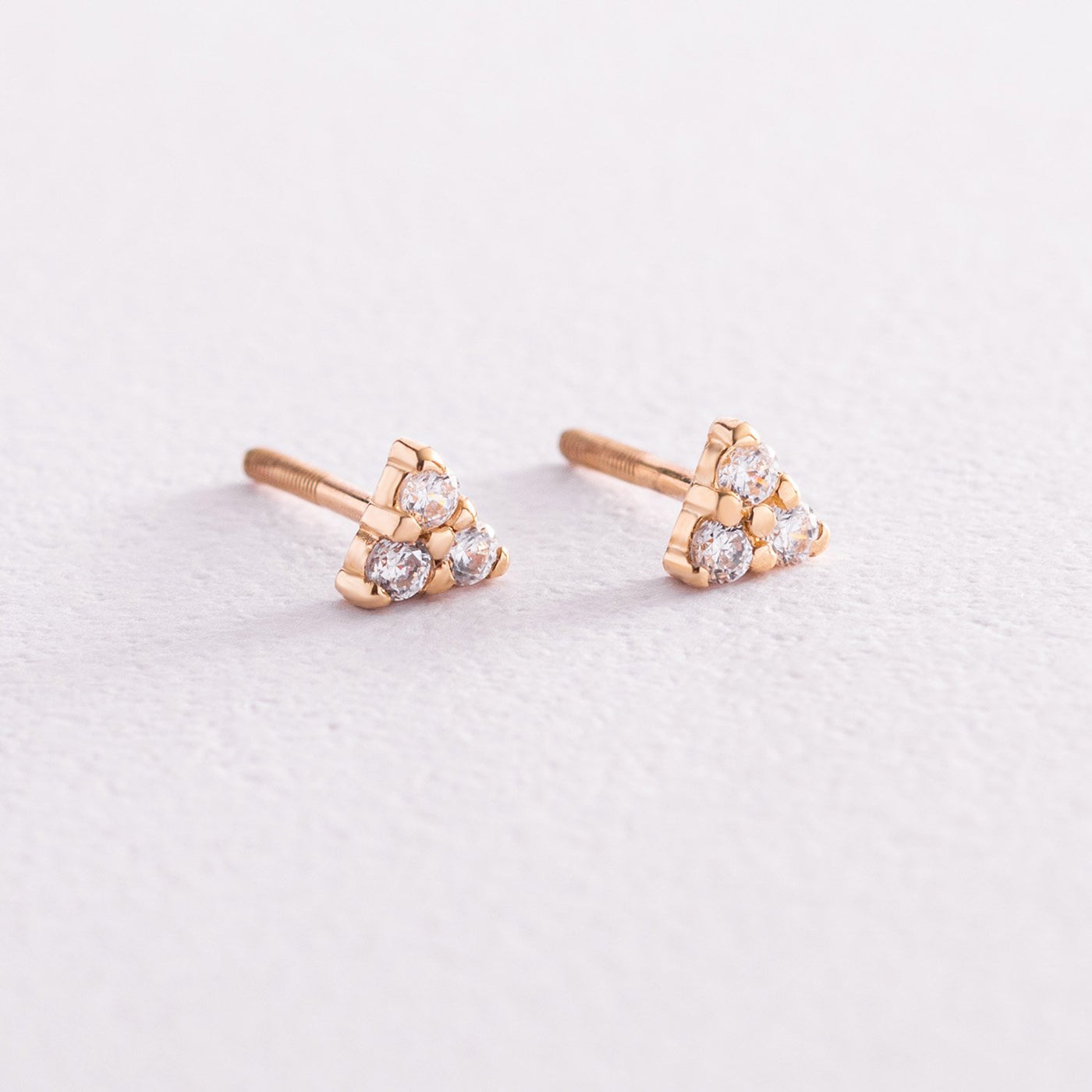 Gold triangle stud earrings with cubic zirconia