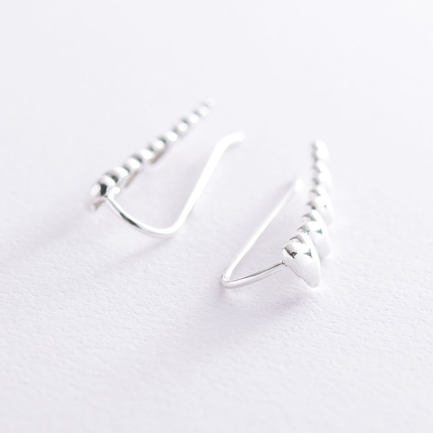 Silver heart climber earrings