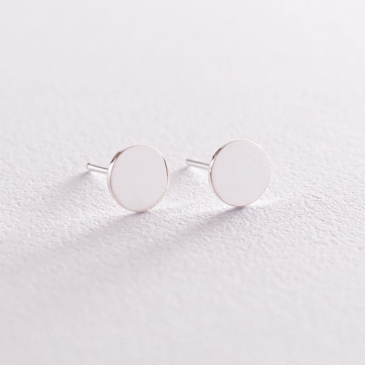 Silver small coins shiny stud earrings