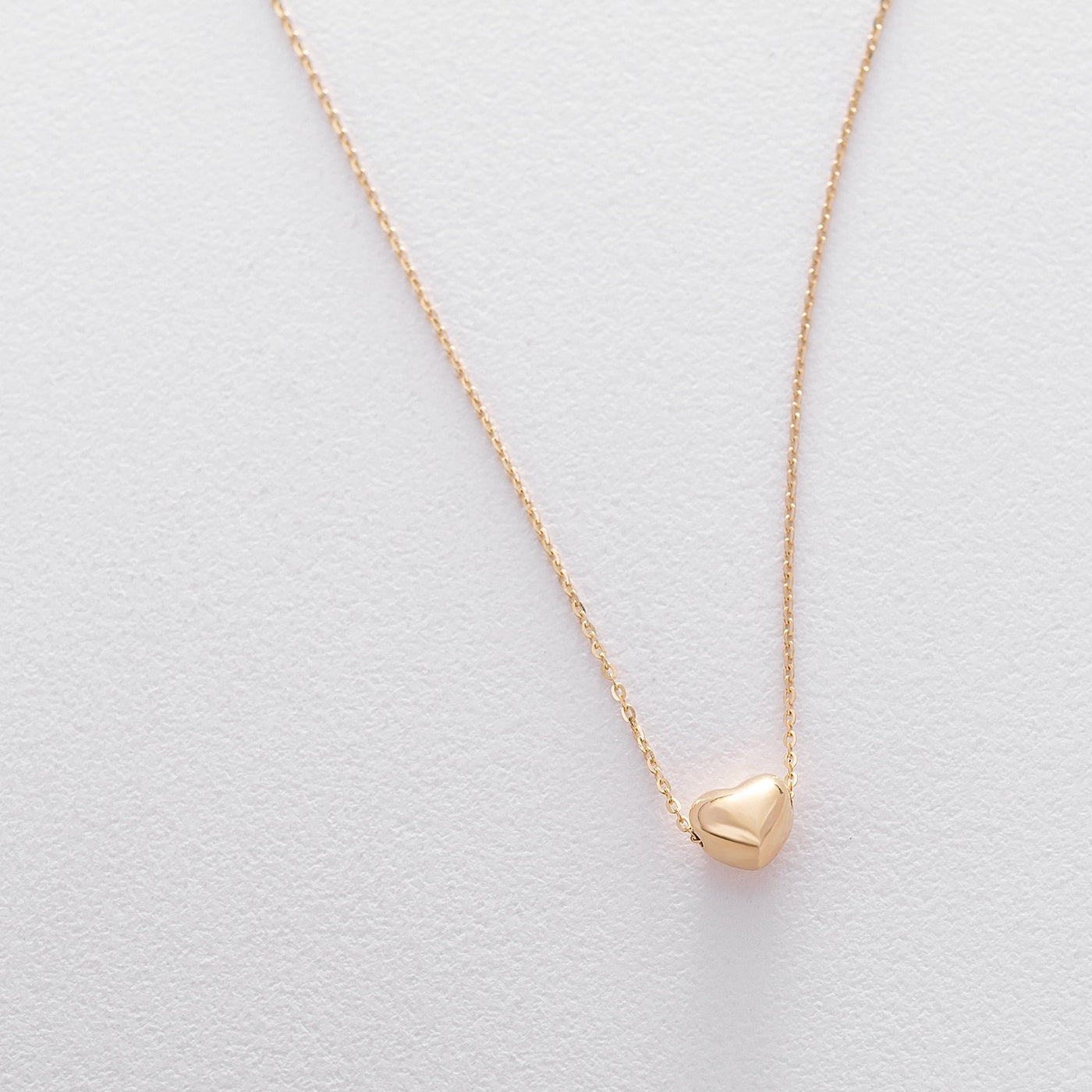 Gold necklace with a heart