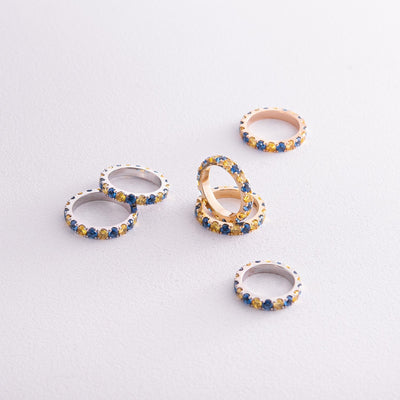 Ring with a path of blue and yellow cubic zirconia