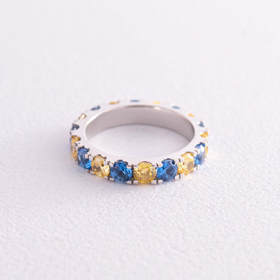 Ring with a path of blue and yellow cubic zirconia