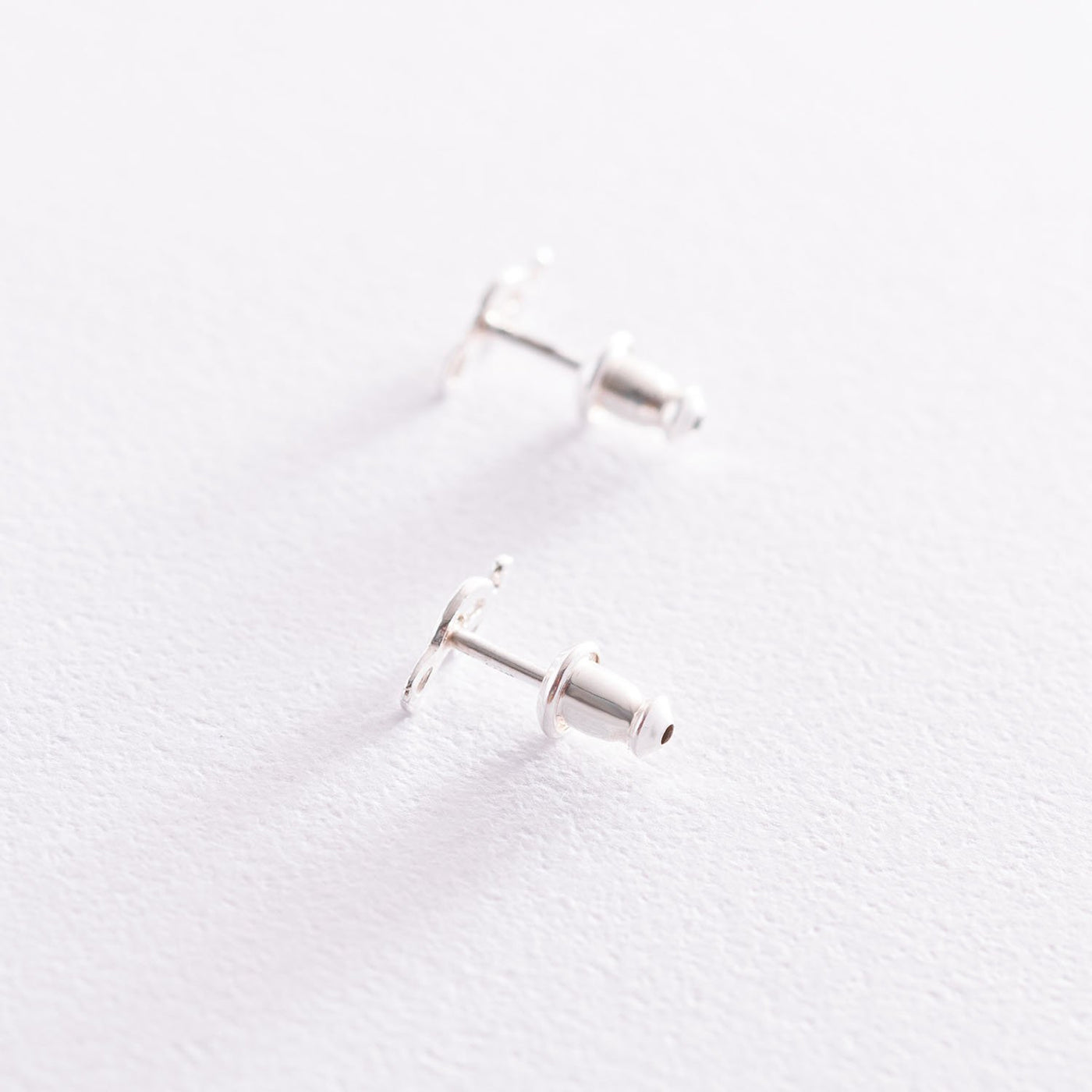 Silver Treble clef stud earrings