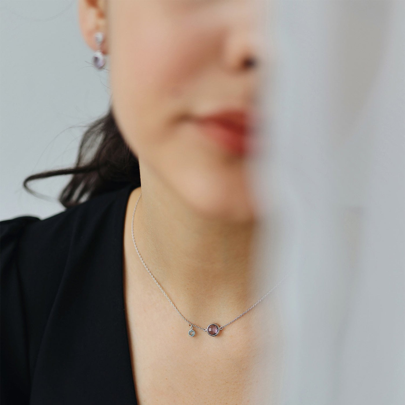 Gold necklace with amethyst and topaz