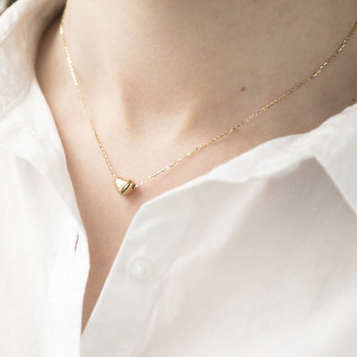 Gold necklace with a heart