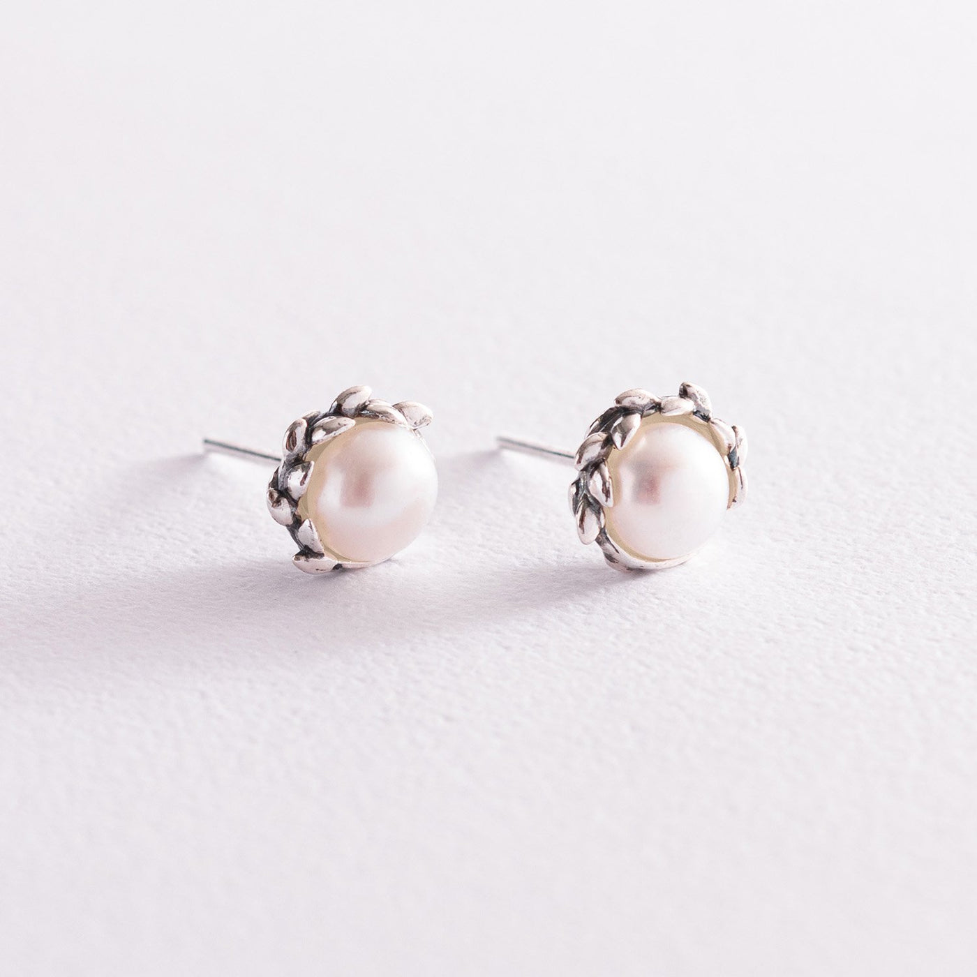 Silver stud earrings with pearls