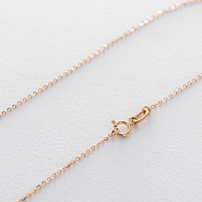 Gold necklace with a heart