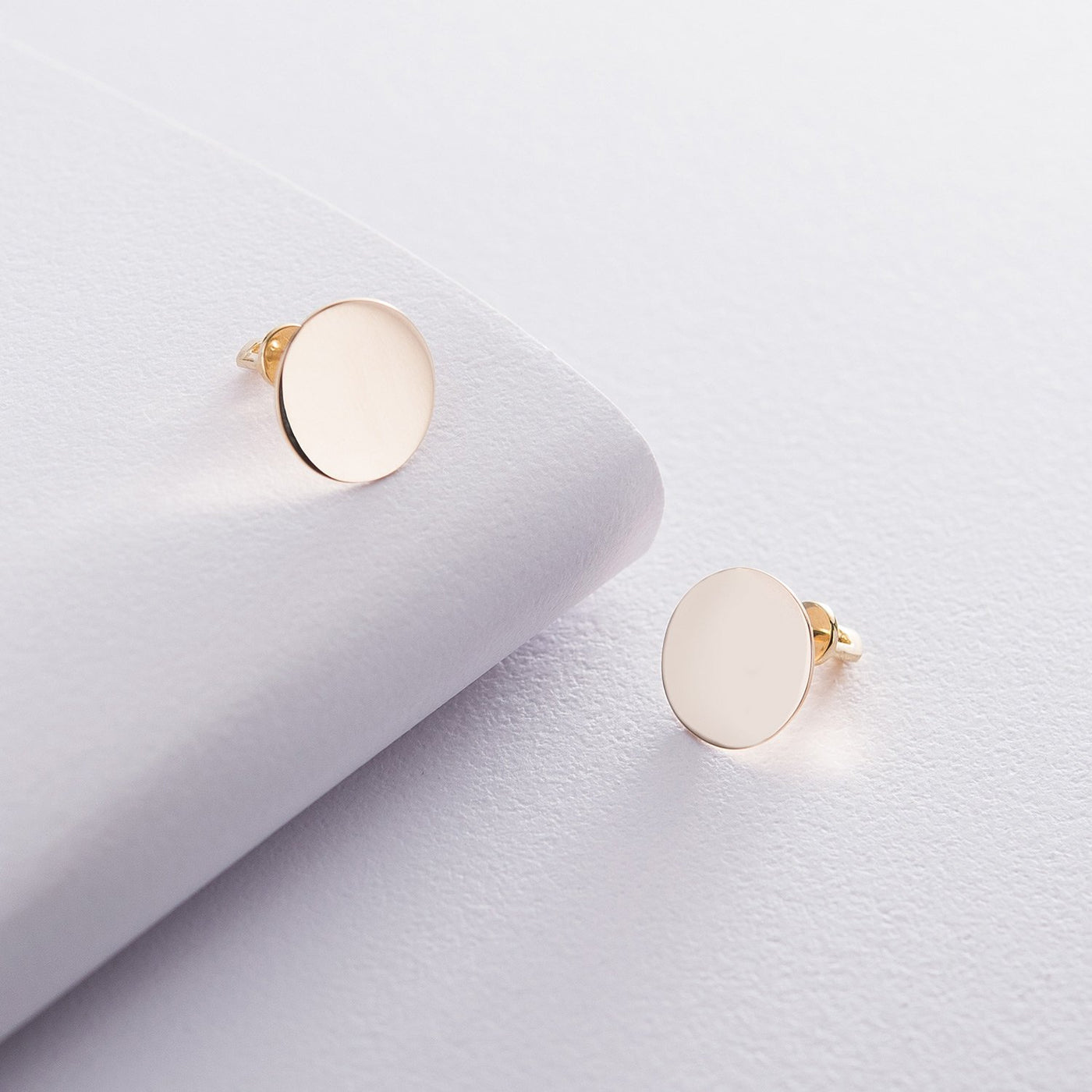 Gold stud earrings