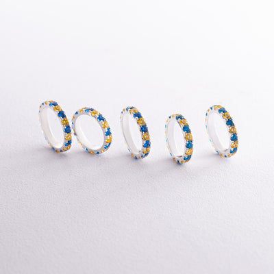 Ring with a path of blue and yellow cubic zirconia