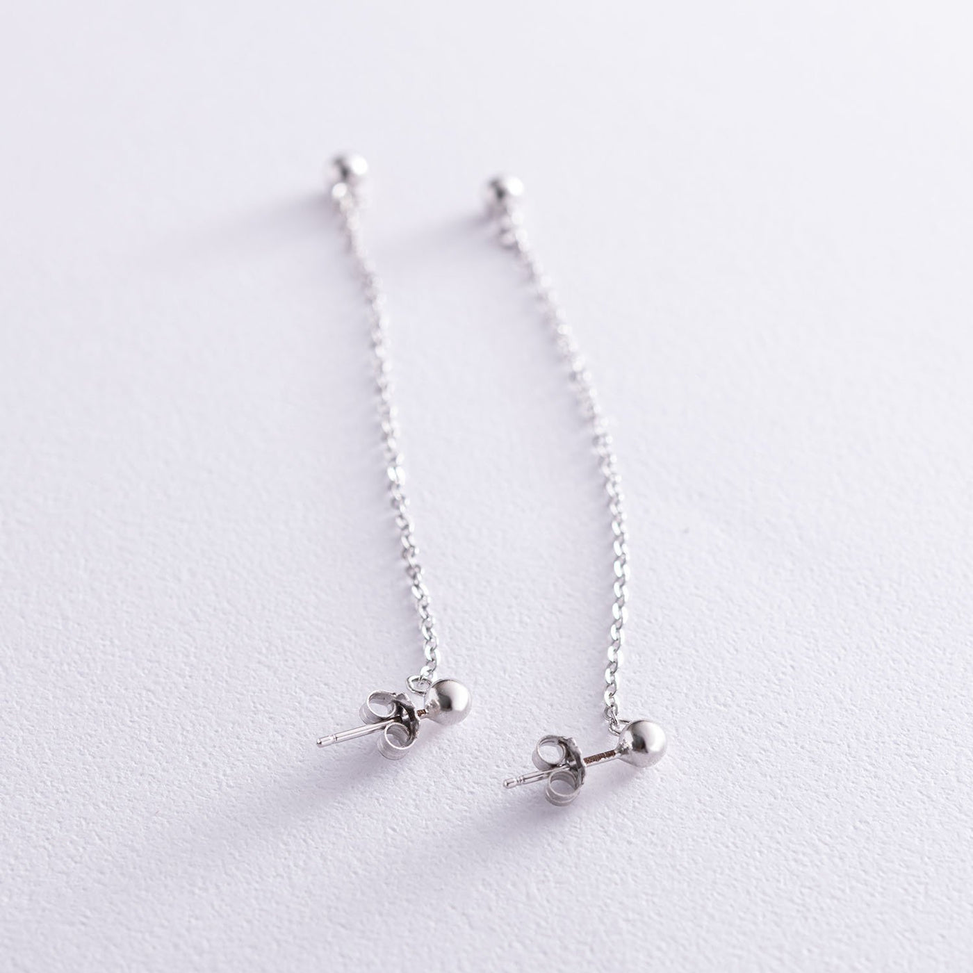 Silver stud earrings Ball on a chain