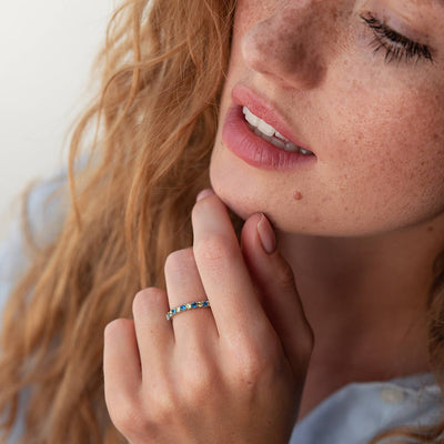 Ring with a path of blue and yellow cubic zirconia