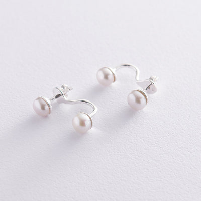 Silver stud earrings with pearls