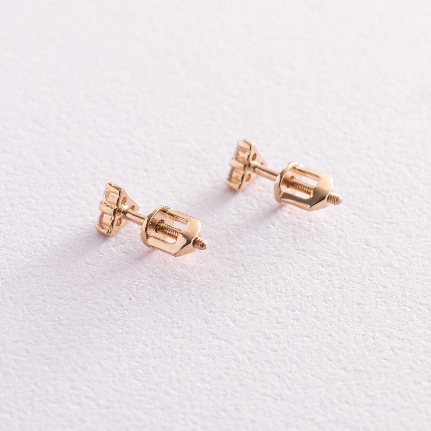 Gold triangle stud earrings with cubic zirconia