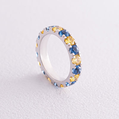 Ring with a path of blue and yellow cubic zirconia