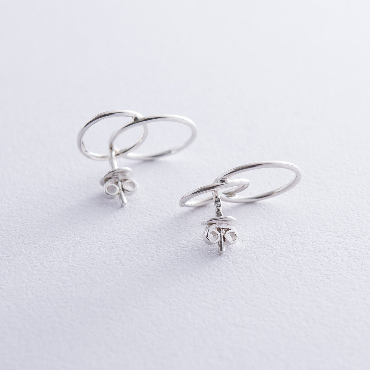 Silver stud earrings Interlacing of rings