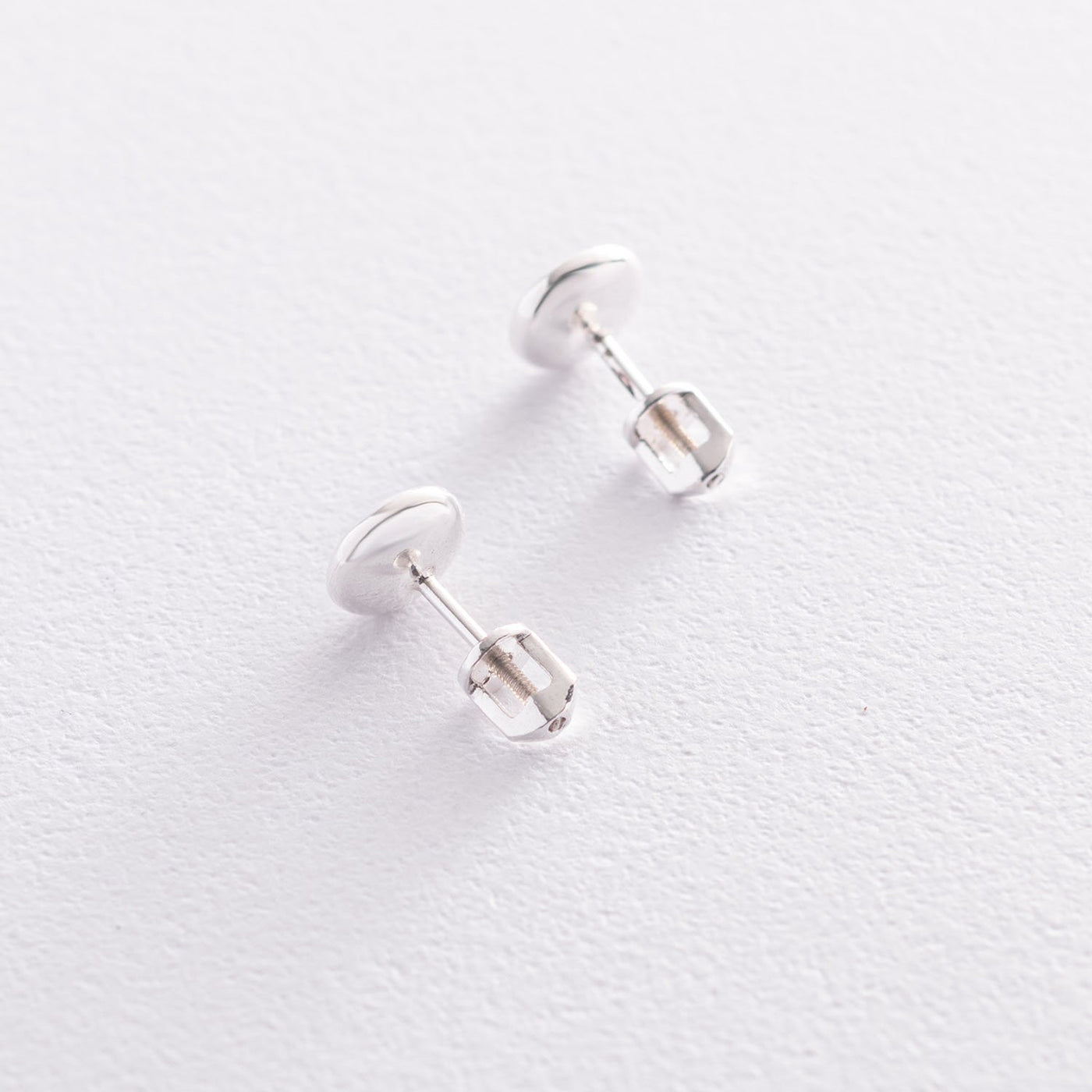 Silver stud earrings with synthetic spinel