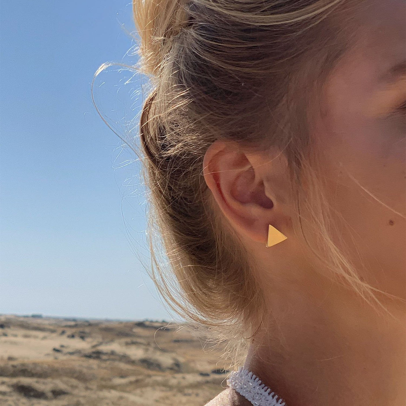 Yellow gold triangle stud earrings