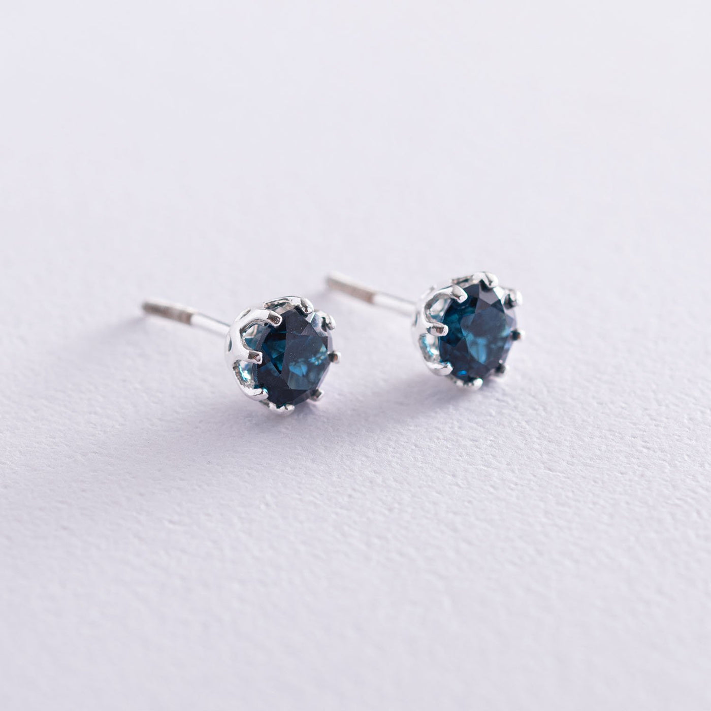 Silver stud earrings  (synthetic London topaz)