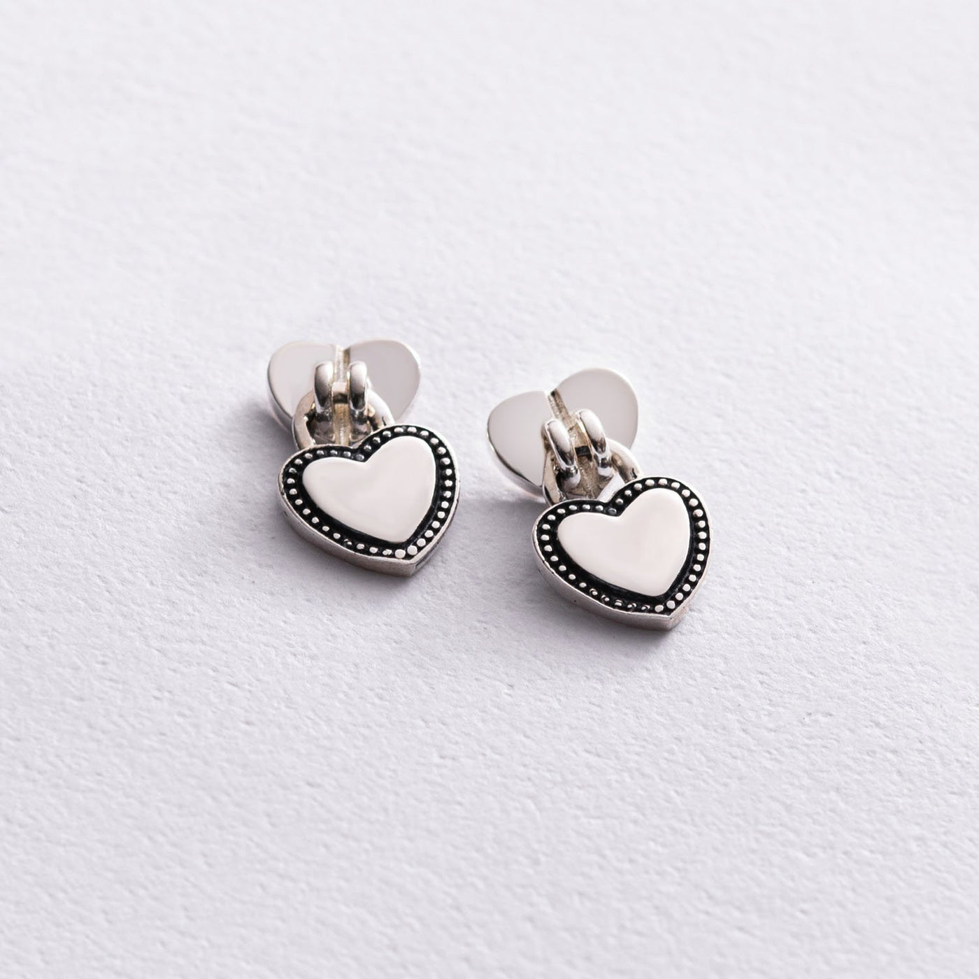 Silver heart and lock stud earrings