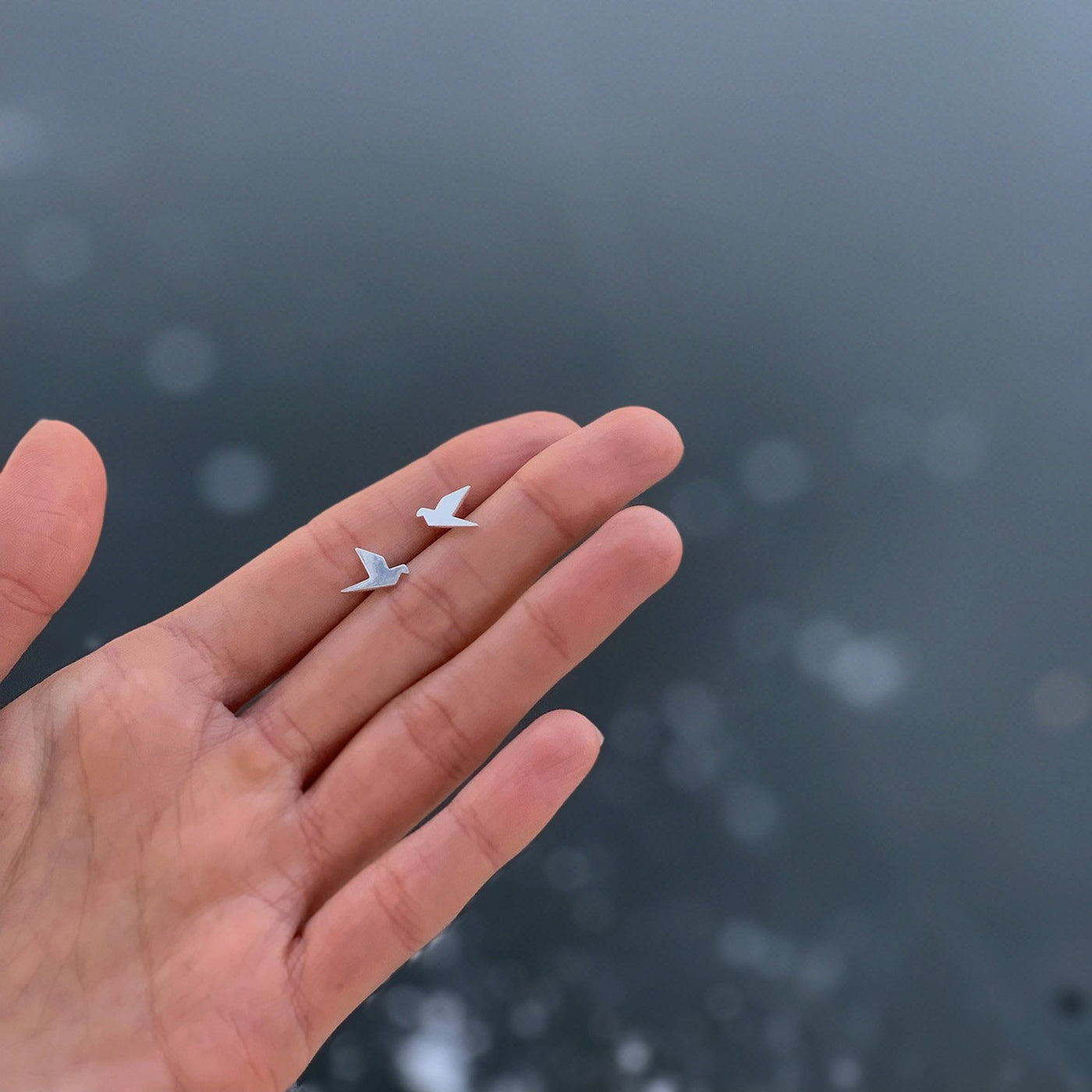 Gold stud flying birds earrings