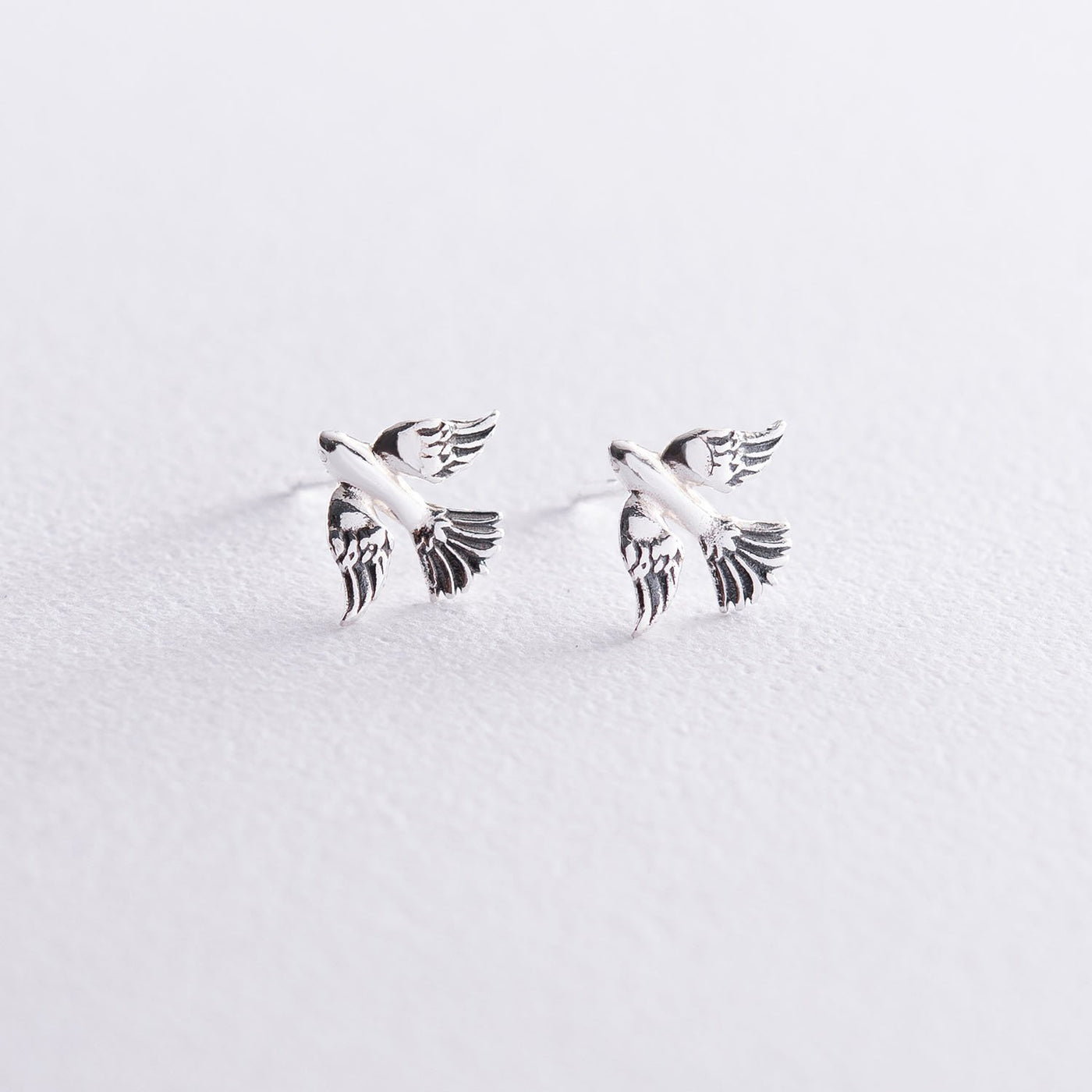 Silver bird stud earrings