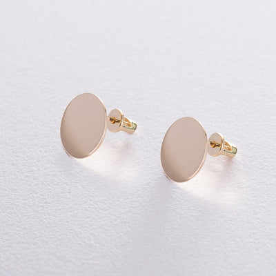 Gold stud earrings