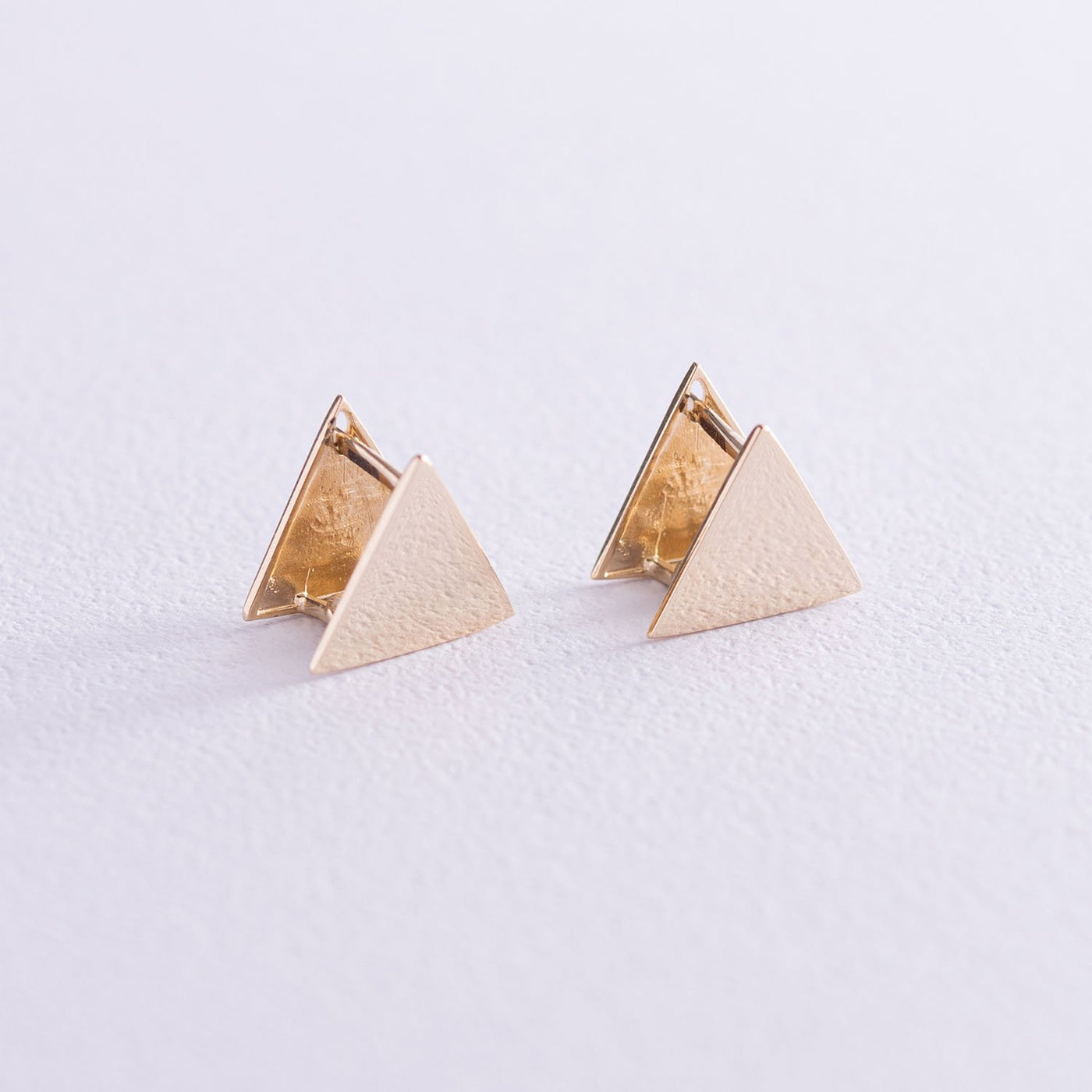 Yellow gold triangle stud earrings