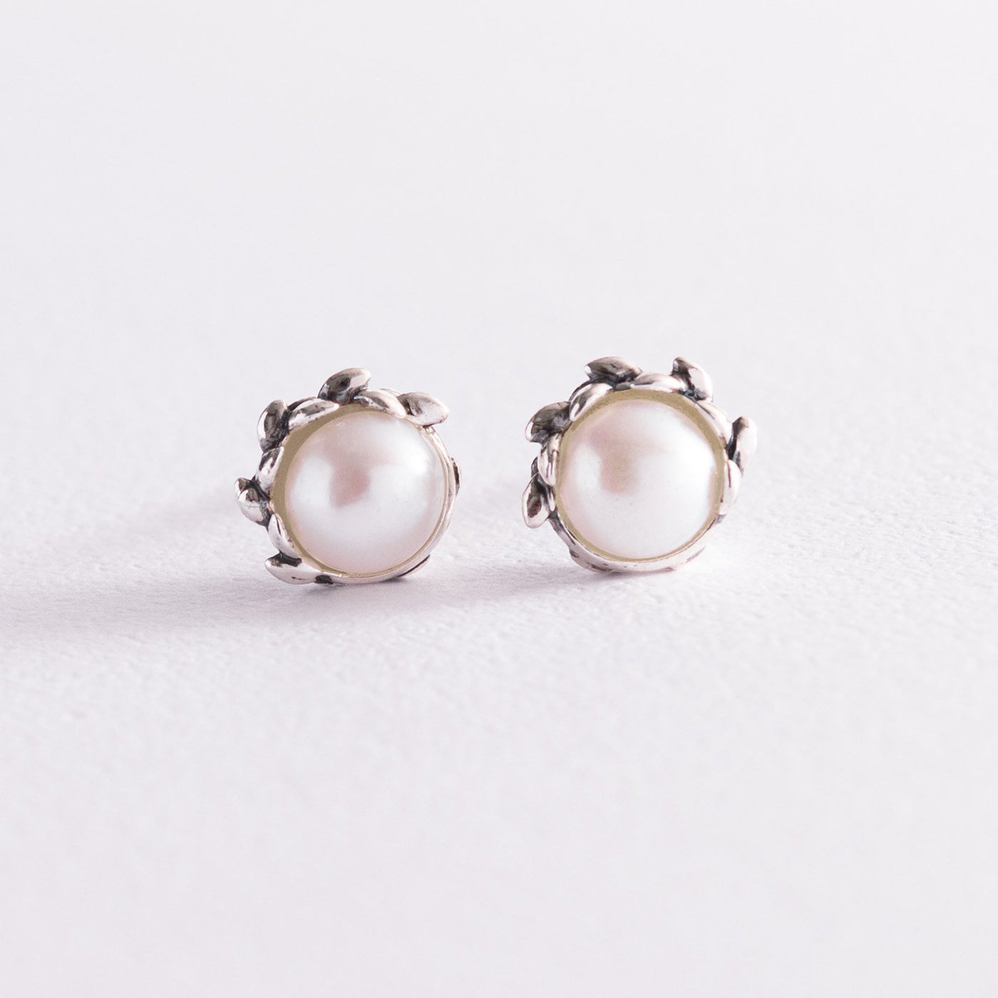 Silver stud earrings with pearls