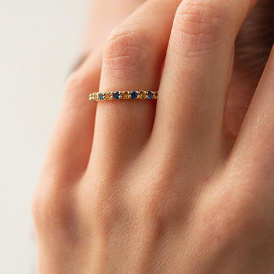 Ring with a path of blue and yellow cubic zirconia